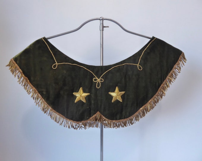 Green priestly circular collar with golden metallic stars and fringes. Vintage liturgical ornament. Circa 1900. Green superhumeral.