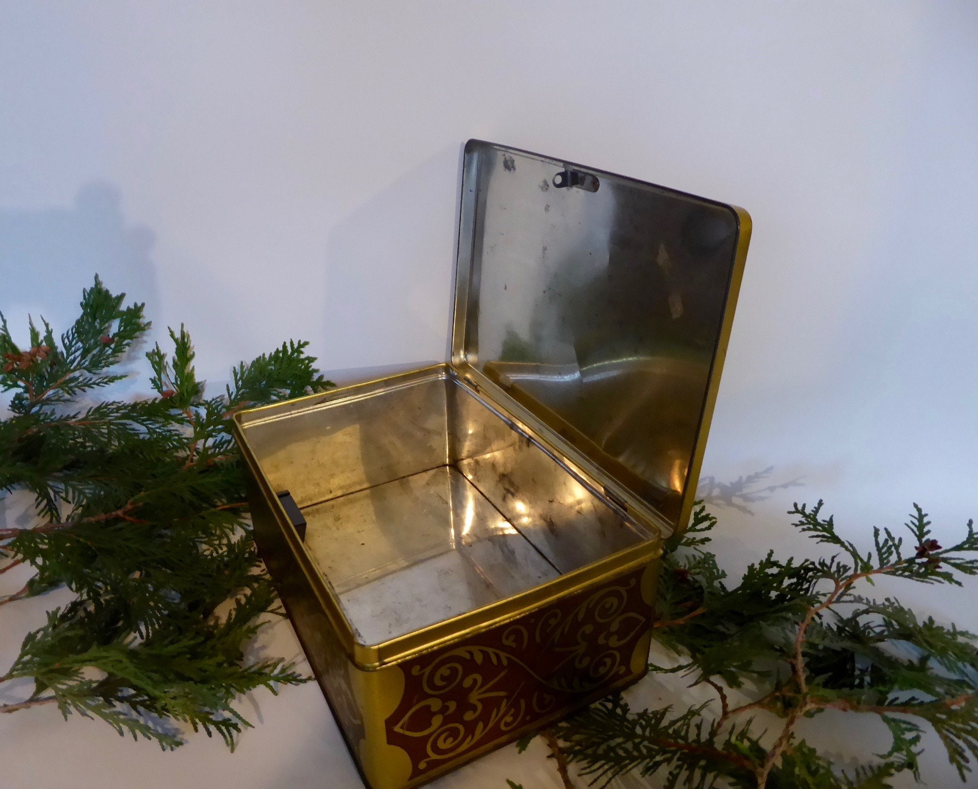 Large vintage metal box with lock. Scene farm inn 17th century. Golden