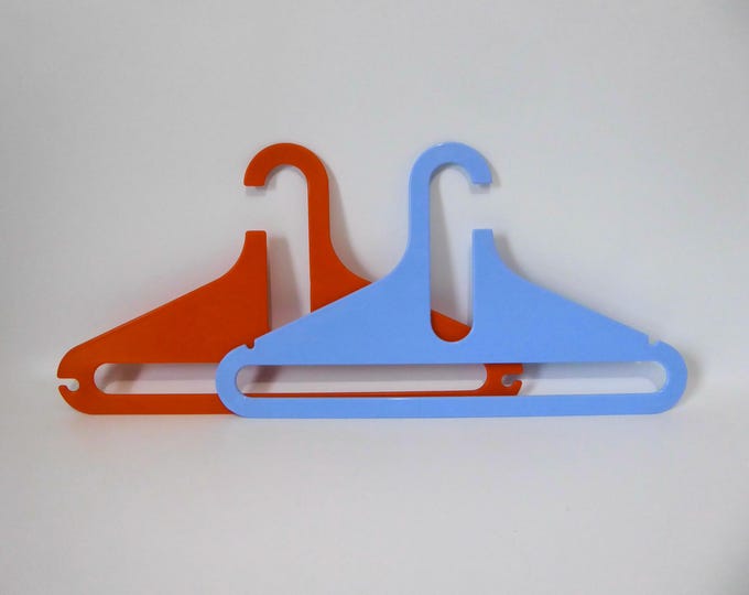 2 orange and powder blue designer plastic hangers. 1970. Finesse. Japan. Mid Century hanger.