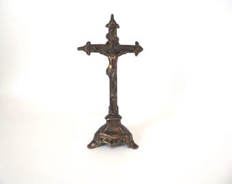 Crucifix on a gilded metal base. 1920. Vintage religious object.