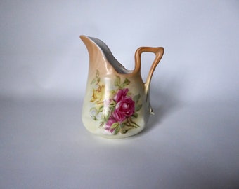 Victorian floral and rose pattern milk jug. Ceramic. 1900