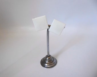 White square plastic ear clip. West Germany. 1970.