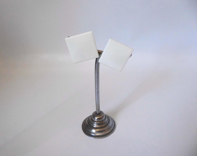 White square plastic ear clip. West Germany. 1970.