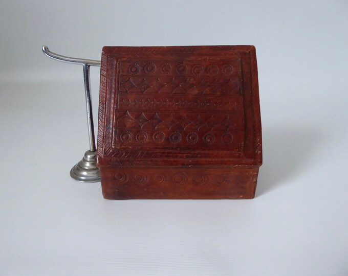 Berber box in embossed leather with traditional pattern. Handmade wooden box of Tuareg origin. 1970. Ethnic art.