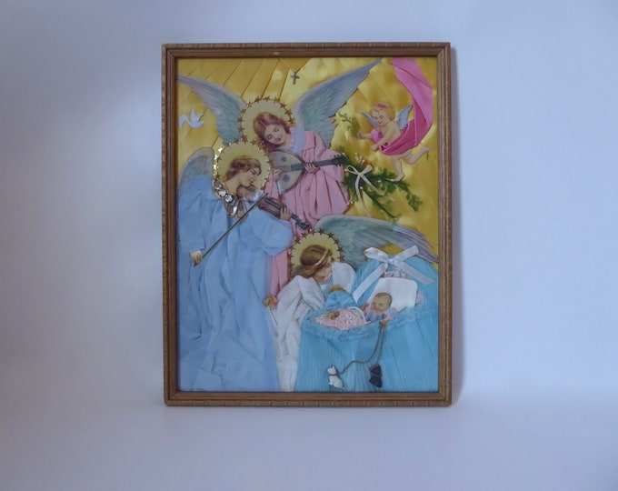 Antique collage frame in 3 dimensions. Birth celebration with 4 angels, baby, cradle. Religious setting. Religious art. 1930-1940.