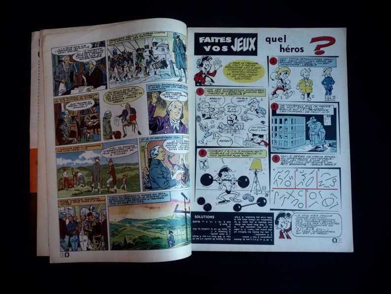 May include: A vintage comic book page with illustrations and text in French. The page features a puzzle with a grid and a question mark. The text on the page reads "Faites Vos Jeux" and "Quel Heros?"