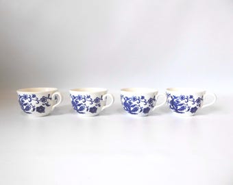 4 white porcelain cups with cobalt blue floral pattern. Japan. 1960.