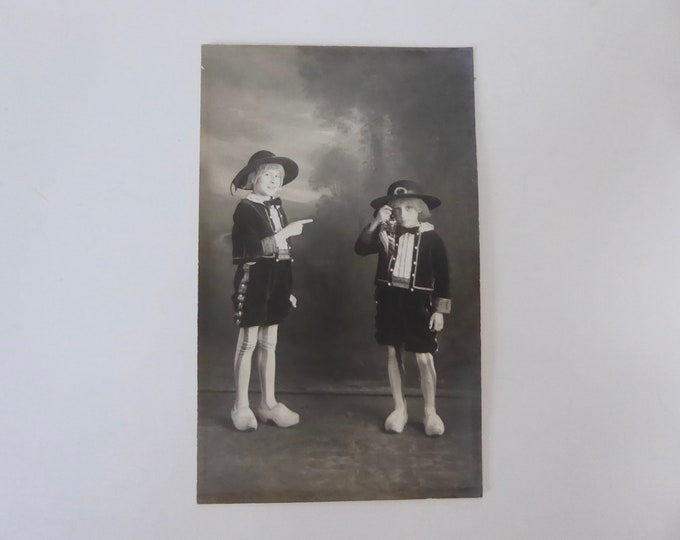 Photo of a child in traditional Breton costume. Photo postcard 1920.