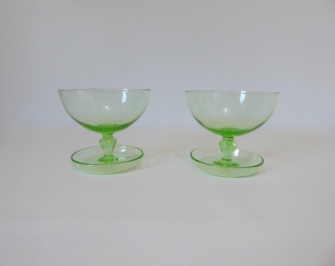 Green glass dessert cup. Depression green. Vintage tableware.  Bowl on foot glass depression. 1960.