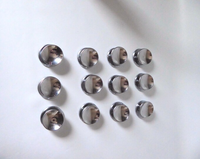 Set of 12 concave handles with plates and screws. Chrome 1950.