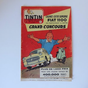 May include: A vintage comic book cover featuring Tintin, a fictional reporter, standing in front of a red Fiat 1100 car. The cover is red with white text that reads "GAGNEZ CETTE SUPERBE FIAT 1100 EN PARTICIPANT A NOTRE GRAND CONCOURS". The cover also includes the text "PLUS DE 1,000 PRIX POUR UNE VALEUR TOTALE DE 400.000 FRANCS".