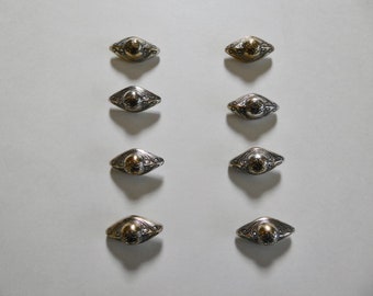 Lot of 8 antique oblong shank buttons in silver-plated copper.
