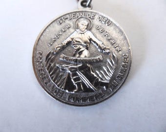 Quebec firefighter protection keychain. Saint John of God keychain. 1970s. Vintage keychain.