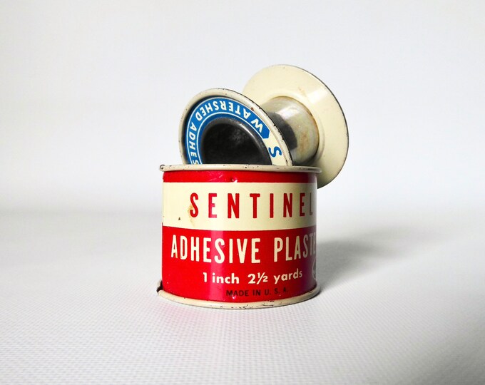 Adhesive plaster. Sentinel. Metal box medical dressing. Made in USA. 1960.