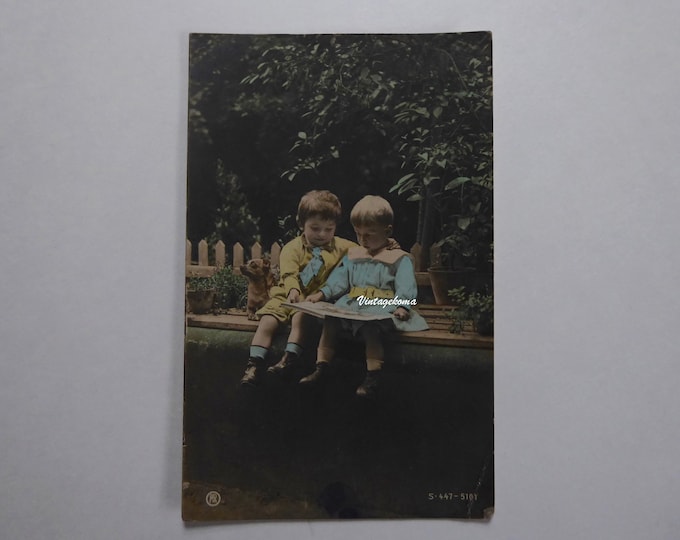 Postcard children sitting. Mr. RPH. 1906. 2 boys and small dog.  Cancelled Canadian stamp 1 cent Edward Vll. Edwardian postcard.