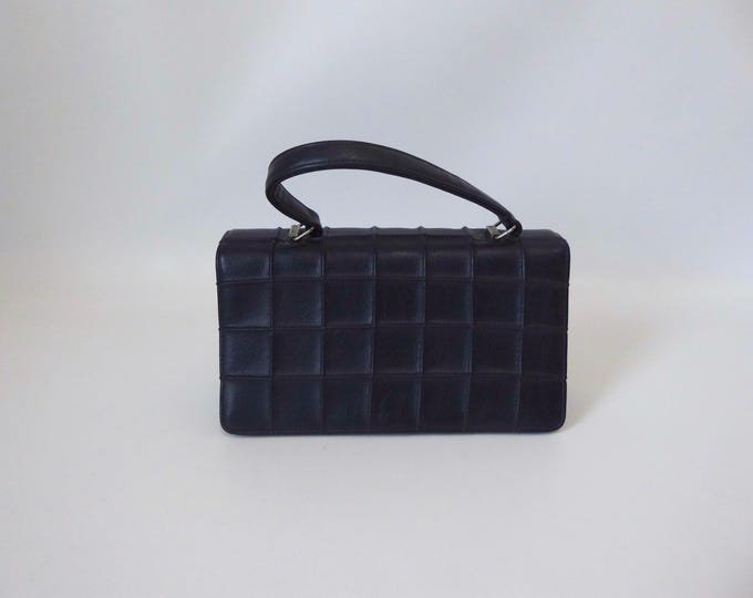 Dark navy blue leatherette handbag. Checkered pattern. 1970s