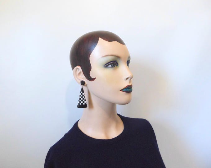 Black and white checkerboard pattern triangle dangle earrings. Lucite jewelry. 1980.