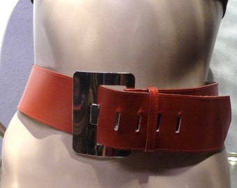Wide red leather belt with chrome buckle. 1980s. Made in Canada. San Francisco. Square chrome buckle. Disco.