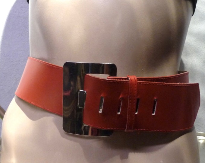Wide red leather belt with chrome buckle. 80s. Made in Canada. San Francisco. Square chrome buckle. Disco.