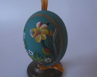 Real hand-painted blown egg to hang. Easter décor. Moss green background and daffodil, ladybug flowers white . Satin and gilding.1980