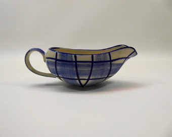 Ceramic sauce boat with stylized blue and white check pattern. 1950s.