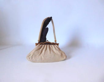 Cream-colored enameled metal mesh handbag. 1950. Mesh Whiting and Davis bags. Made in USA.
