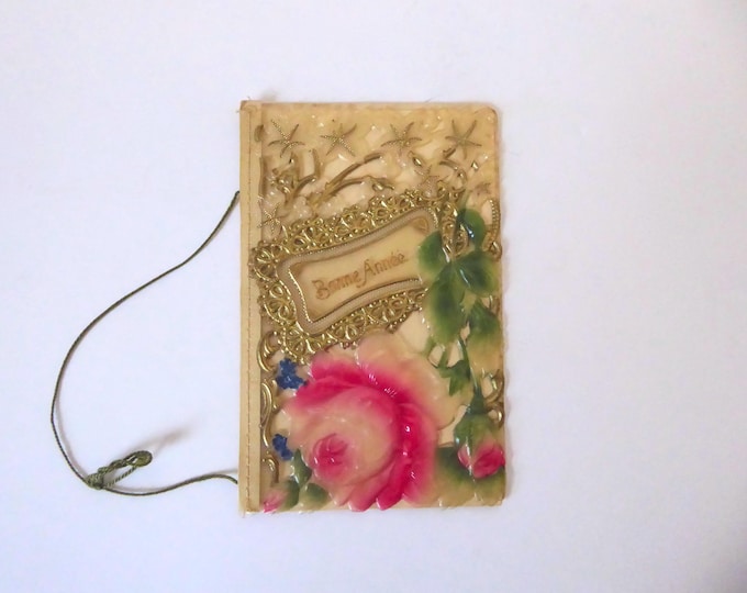 Vintage New Year's greeting card. Gold celluloid with embossed, scalloped edges. Made in Germany. Circa 1910.