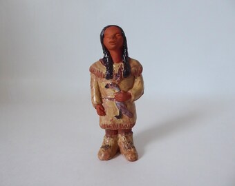 Terracotta statuette of a young girl with bustard. Indigenous Crafts Canada. Sign. Year 1970.