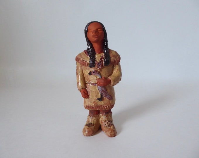 Terracotta statuette of a young girl with bustard. Indigenous Crafts Canada. Sign. Year 1970.