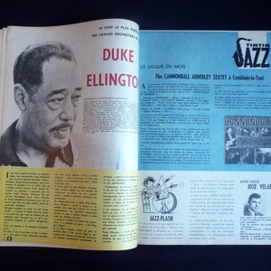 May include: A magazine cover featuring a black and white photo of Duke Ellington, a famous jazz musician. The cover also includes a photo of the Cannonball Adderley Sextet, a jazz band, and a photo of Jose Velaers, a jazz singer. The magazine is titled "Tintin Jazz" and features the text "Le Disque du Mois" and "The Cannonball Adderley Sextet &agrave; Comblain-la-Tour".