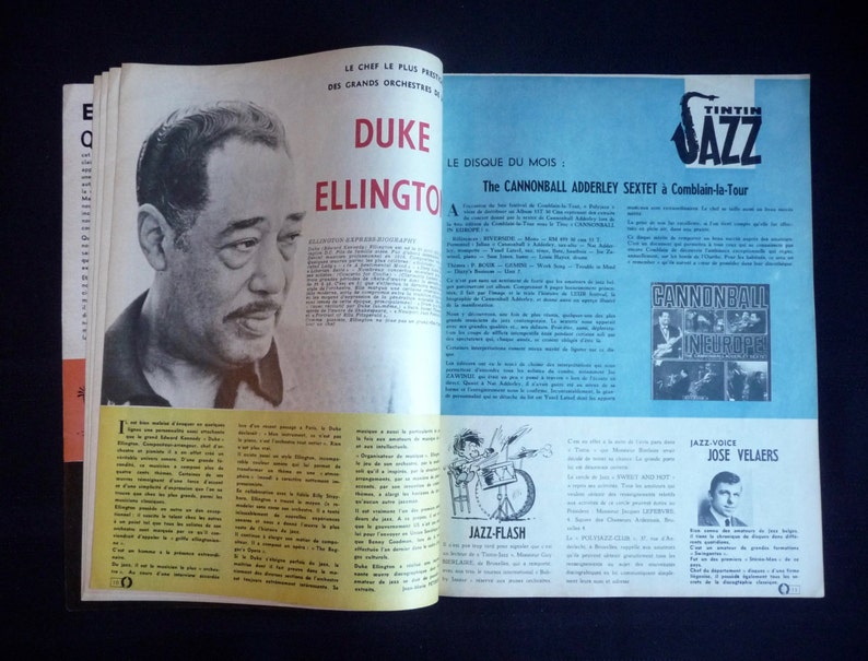 May include: A magazine cover featuring a black and white photo of Duke Ellington, a famous jazz musician. The cover also includes a photo of the Cannonball Adderley Sextet, a jazz band, and a photo of Jose Velaers, a jazz singer. The magazine is titled "Tintin Jazz" and features the text "Le Disque du Mois" and "The Cannonball Adderley Sextet &agrave; Comblain-la-Tour".