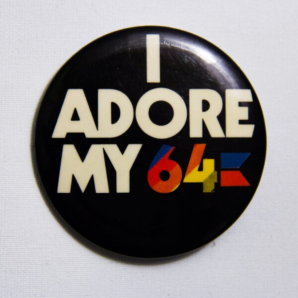 Vintage Commodore 64 computer pinback button/badge from 1985, 2", round