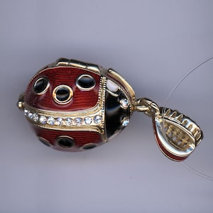 Russian Faberge Silver egg Pendant with red Lady Bug, w/gold trims opens up with subject inside .925 Sterling