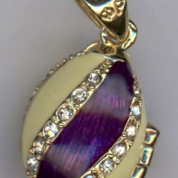 Russian Faberge Purple/White egg Pendant, opens up angel inside. Pendant swirls with the colors and banded in gems.