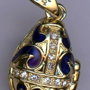 Russian Faux Faberge Egg Pendant Blue and Gold mixed into a sharp design with gems in offset lines  .925 Sterling