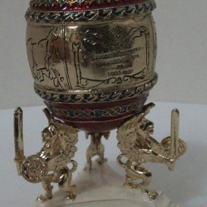 Russian Replica Red/Metallic Enameled Faberge egg, representing the Siberian R/R, writings of the history and mini-train