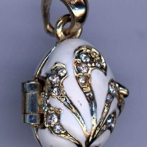 Russian Faberge Silver egg Pendant, White w/golden swirls, embedded with Gems, opens to Red Heart inside .925 Sterling