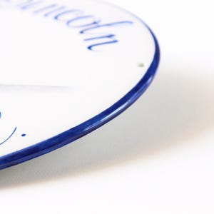 Ceramic plaque edge detail hand-painted in blue