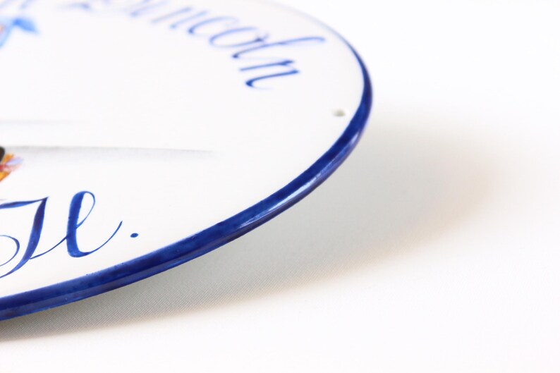 Ceramic plaque edge detail hand-painted in blue