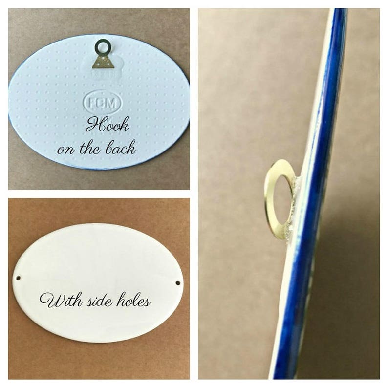 May include: White oval ceramic sign with the text "Hook on the back" and "With side holes". The sign has a gold metal hook on the back.