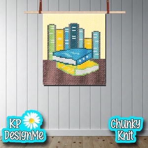 May include: A chunky knit wall hanging depicting a stack of books in shades of blue, yellow, and green. The background is a light yellow, and the bottom portion is a brown knit. The text "KP DesignMe" and "Chunky Knit" are in the image.