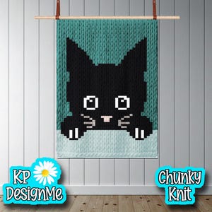May include: A chunky knit wall hanging featuring a black cat design. The cat has white eyes, whiskers, and paws, set against a teal background. The words "KP DesignMe" and "Chunky Knit" are also visible.