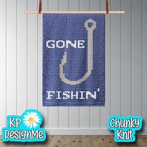 May include: A blue chunky knit wall hanging with a large white fishing hook design. The words "GONE FISHIN'" are displayed in white block letters. The wall hanging is suspended from a wooden rod with leather straps.
