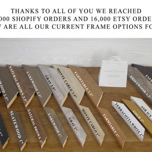 May include: A variety of wood frame options for artwork, with different colors and sizes. The frames are arranged in two rows, with the larger frames on top and the smaller frames on the bottom. The frames are labeled with their names and sizes, such as "Black 2.5", "Slatewood 2.5", "Natural Brown 2.5", "Lakewood 2.5", "Gray 2.5", "Monte Carlo 2.5", "Farmtable 2.5", "Driftwood 2.5", "Espresso 2.5", "Ash Ice 1", "Gold 1", "Terracotta White 1", "Farmtable 1", "Monte Carlo 1", "Gray 1", "Lakewood 1", "Natural Brown 1", "Slatewood 1", and "Black 1".