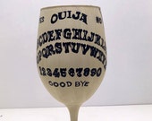 Ouija inspired hand painted wine glass.