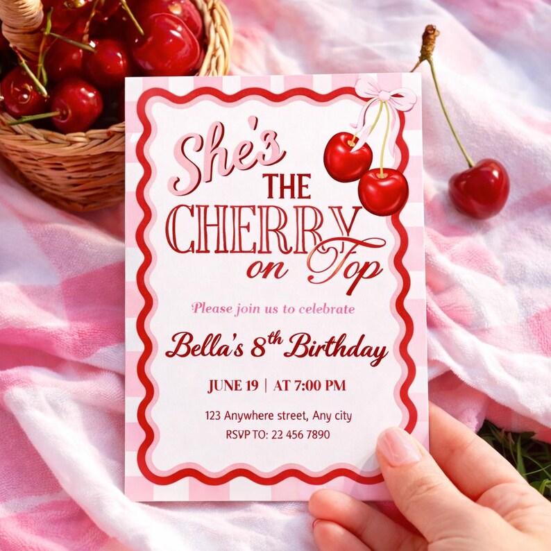 May include: A pink and white birthday invitation card with the text "She's the Cherry on Top". The card is for Bella's 8th birthday, with the date, time, and RSVP details. The design includes red cherries and a pink bow. The card is held by a person.