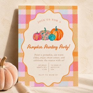 Könnte beinhalten: Eine rechteckige Einladungskarte mit einem karierten Rand in Orange, Pink und Blau. Die Mitte zeigt einen geschwungenen Rahmen mit vier gemalten Kürbissen und dem Text: Join us for a Pumpkin Painting Party! Paint a pumpkin, sip warm cider, enjoy sweet treats, and celebrate the season with us! Saturday March 8th 12 PM, 123 Main St. Anycityn USA, RSVP to Mom by.