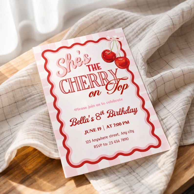 May include: A pink and white invitation card with the text "She's the Cherry on Top" and "Bella's 8th Birthday". The card features a red scalloped border and cherry illustrations. The invitation includes the date, time, and RSVP information.