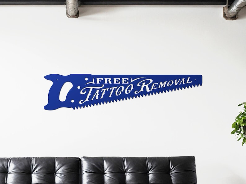 Sign shaped like a handsaw with the words Free Tattoo Removal cut out of it. Powder coated in a gloss blue powder coat.