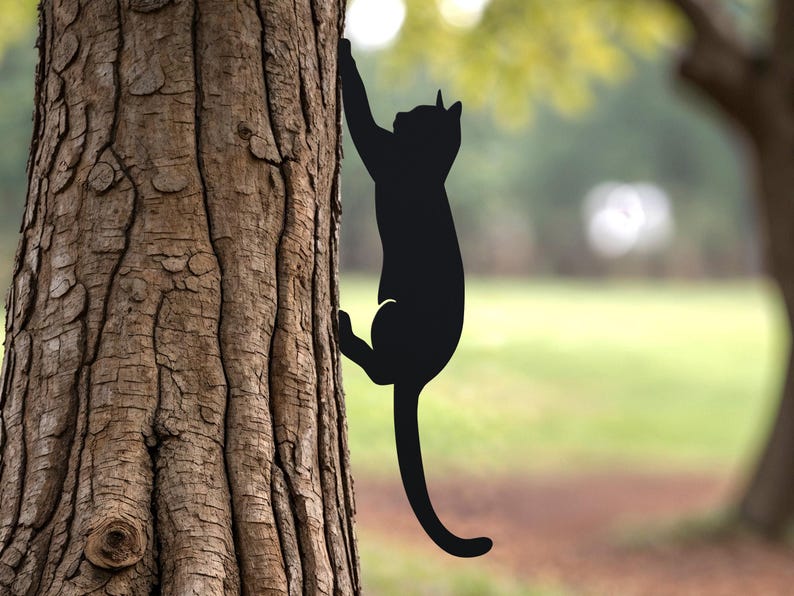 Shows a black metal cat climbing a tree.